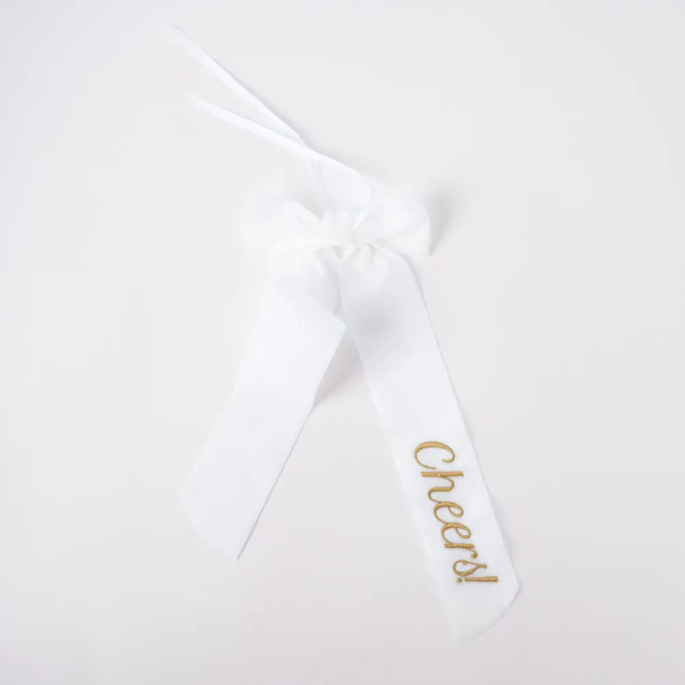 No Reservations Place Settings & Linens|Wine Bow “Cheers”